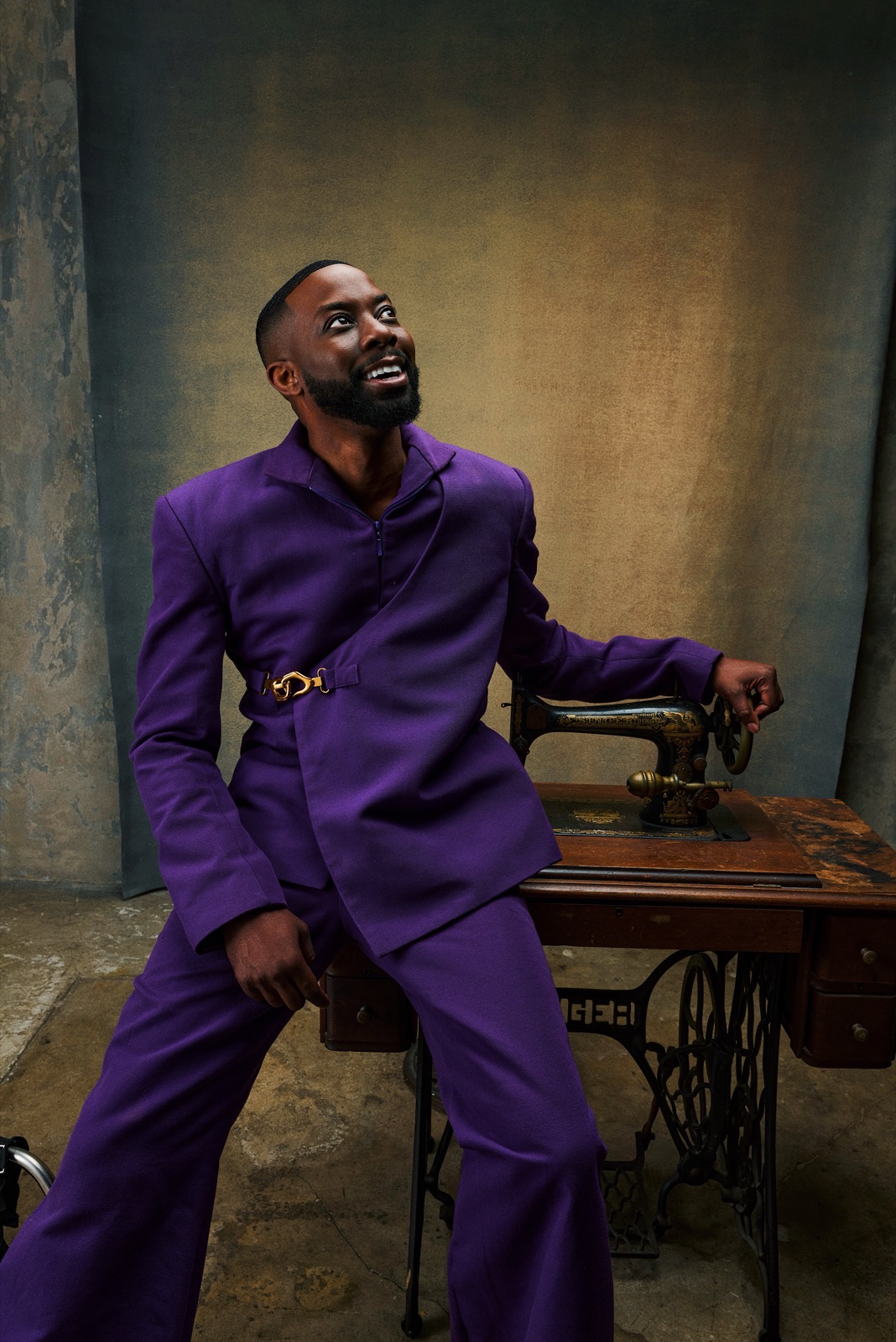 John Imah in a purple suit in an editorial portrait