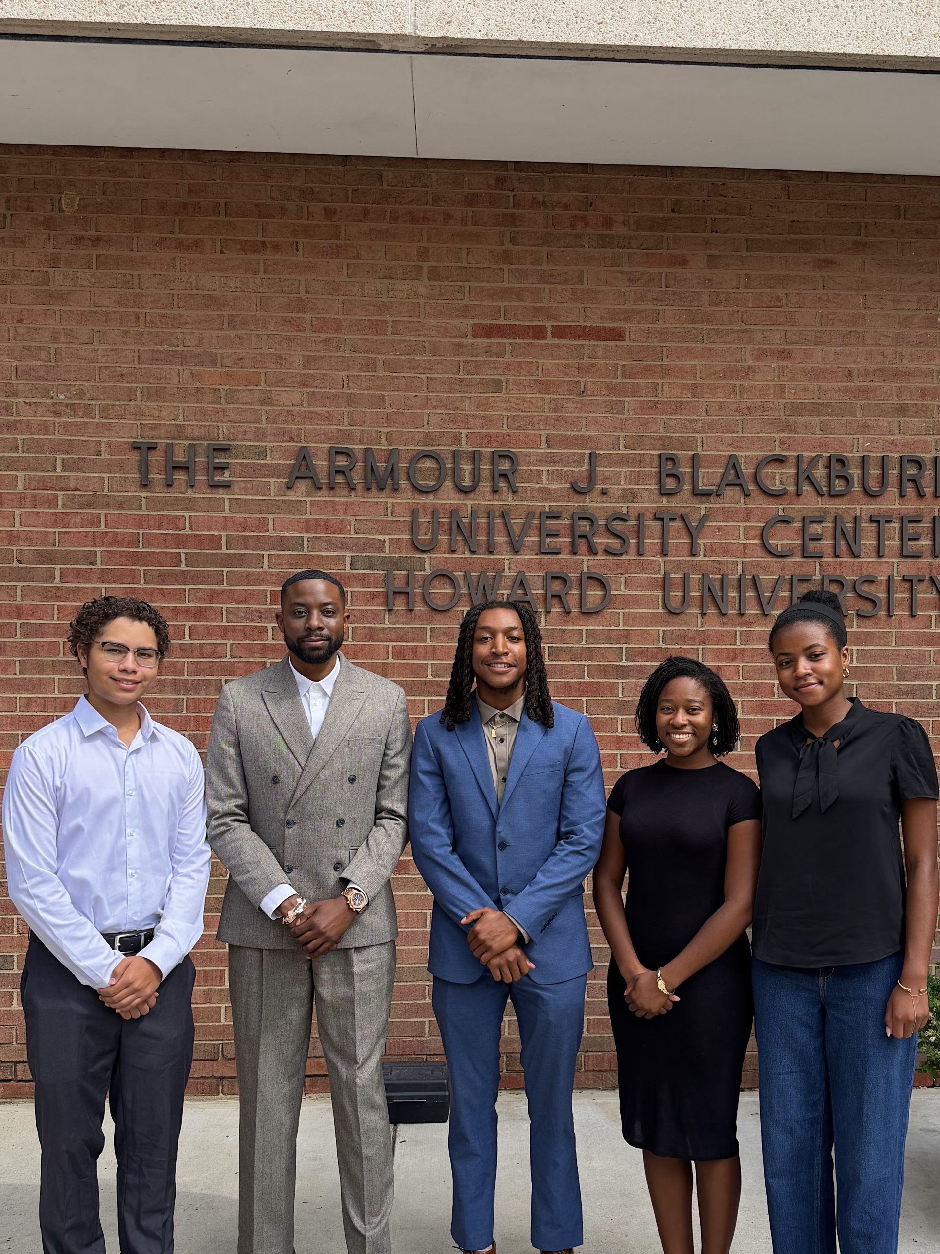 John Imah with students outside the Armour J. Blackburn University Center at Howard University.